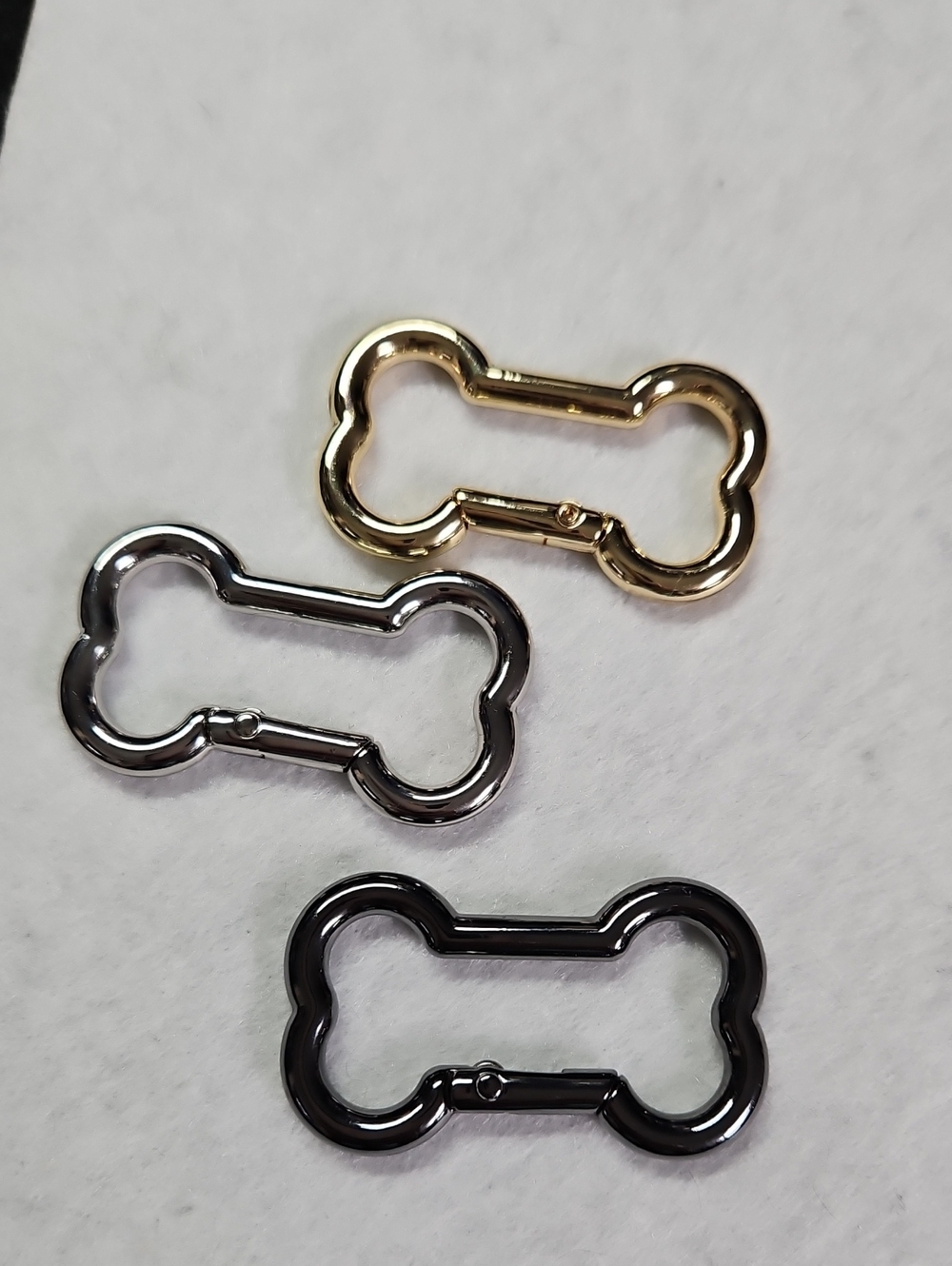 Gold, Silver & Gun-metal Bone-Shaped Carabiners for Pepe Charity